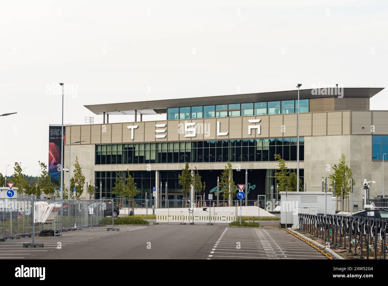 tesla gigafactory berlin brandenburg entrance with the logo sign building exterior of the huge factory of the bev manufacturer 2XW52G4